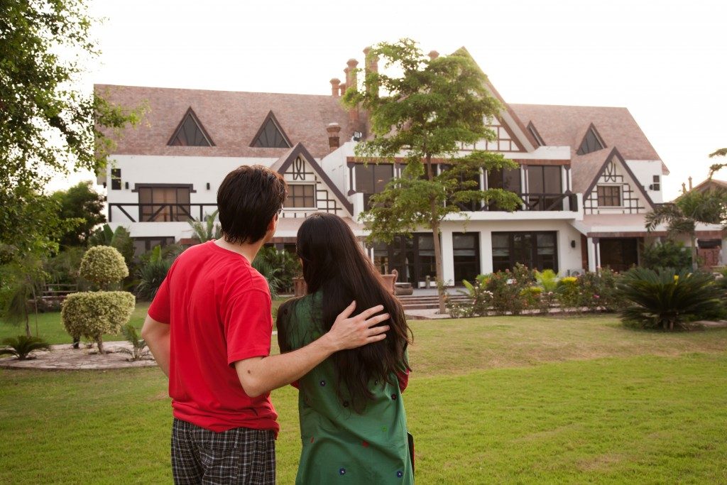 couple looking at their home