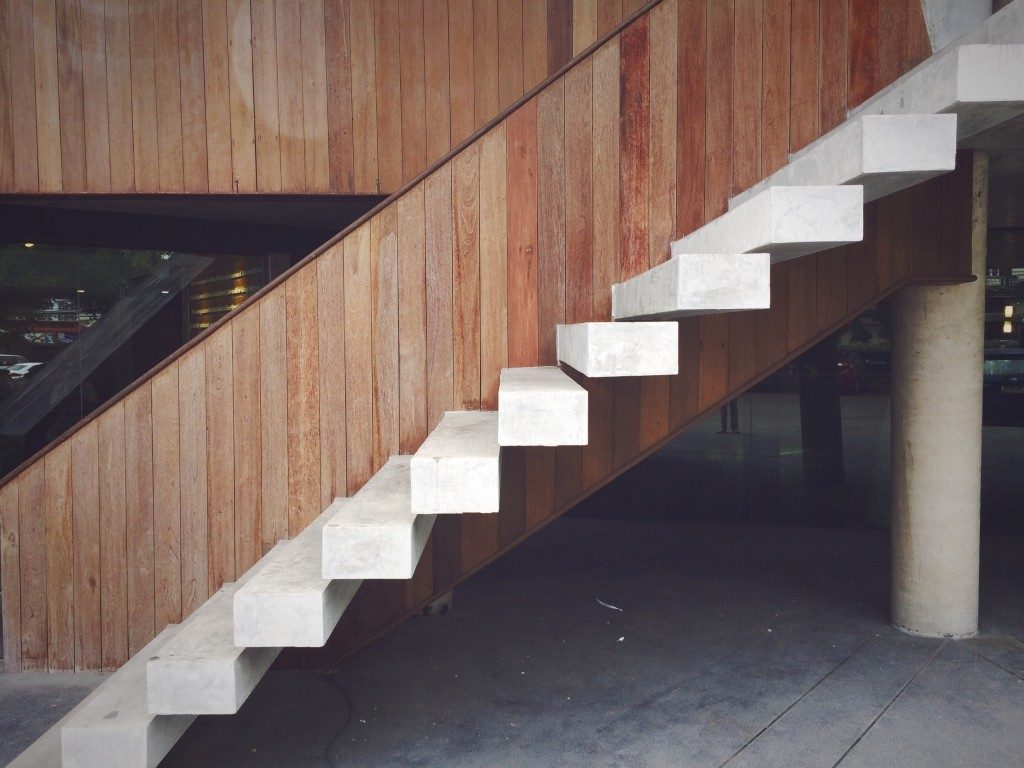 white stairs with wooden accent