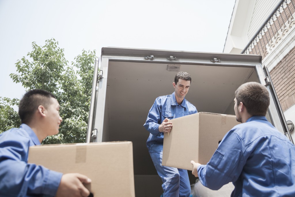 movers carrying boxes