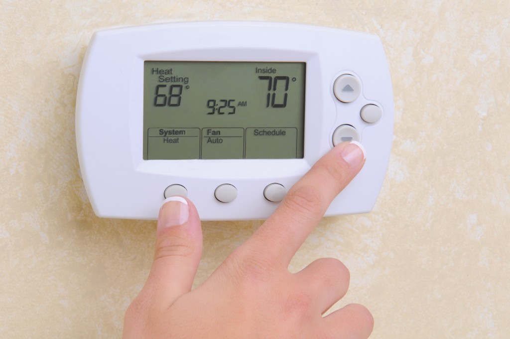 Setting the room temperature on a modern programmable thermostat