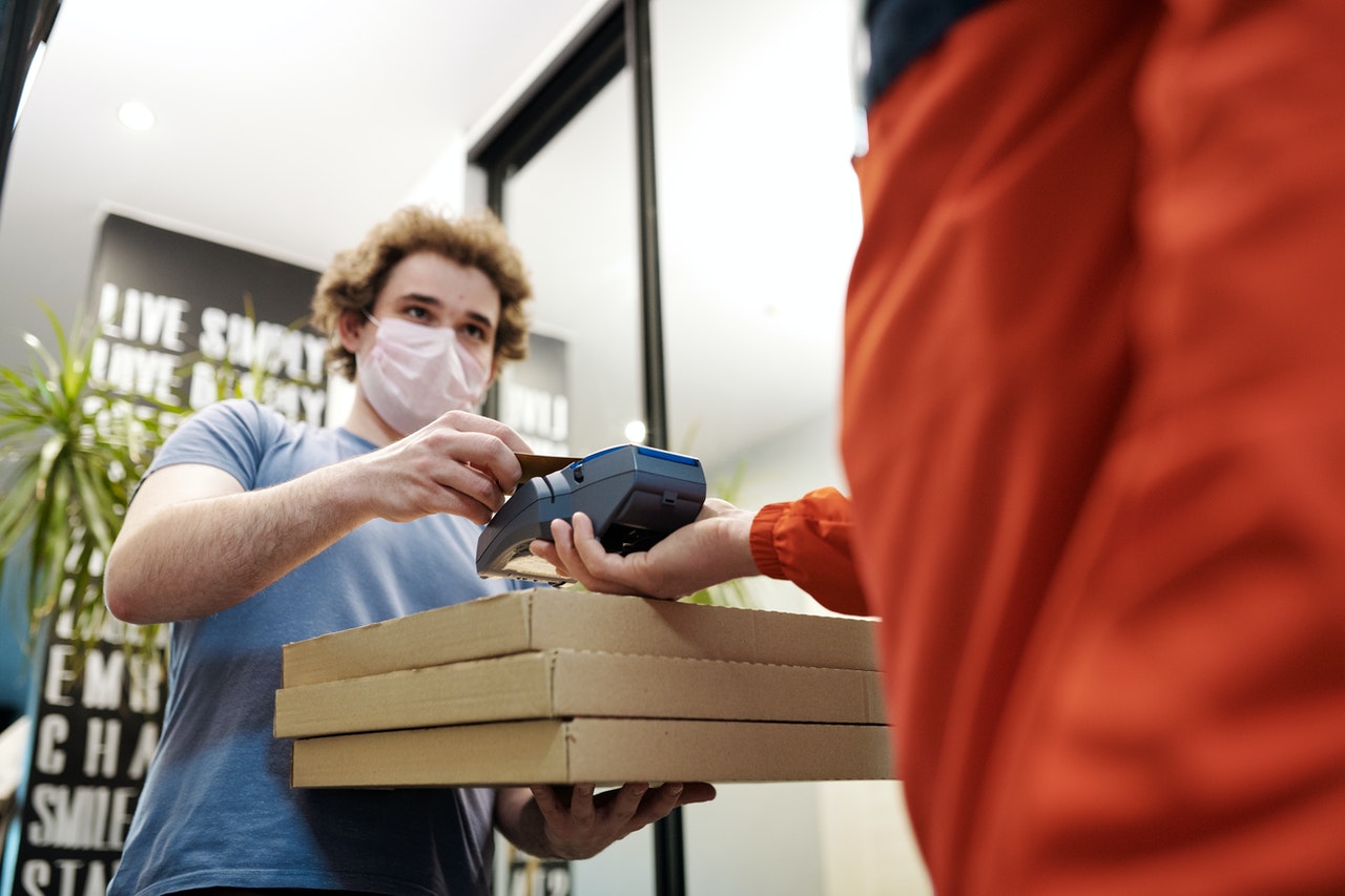 a deliveryman receiving payment