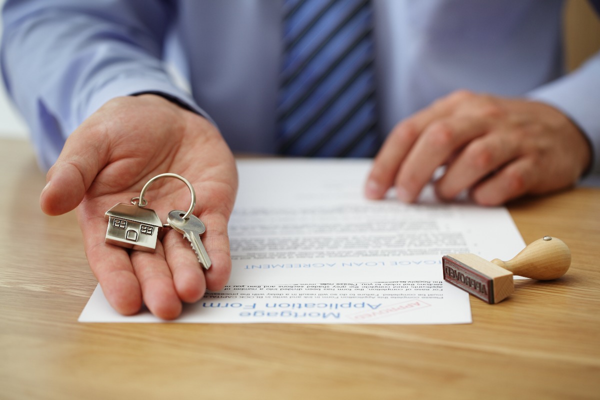 man holding house keys