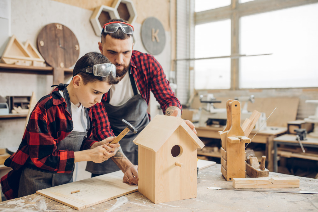 dad and son doing DIY