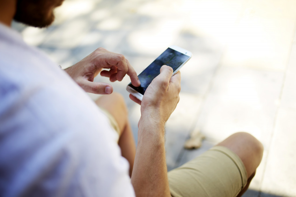 A person holding his phone