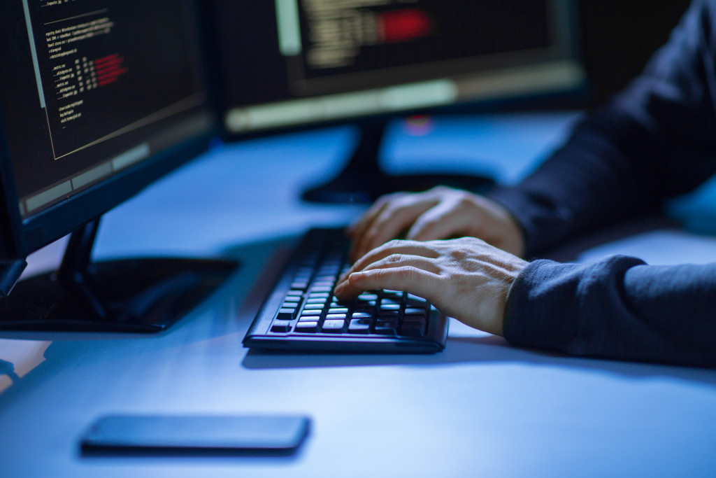 a person typing on a computer