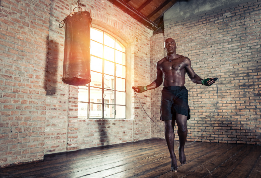 man jumping rope in his home gym