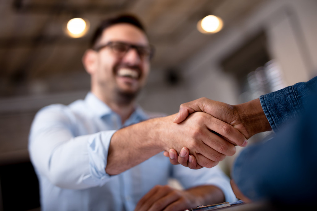 man handshaking a person