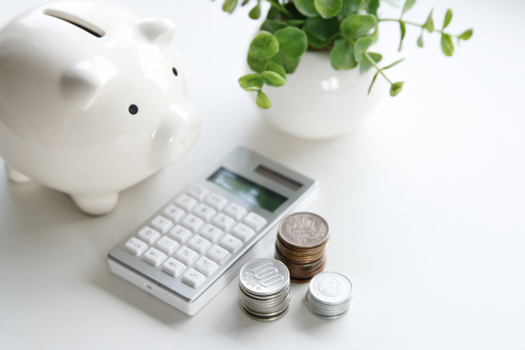 piggybank and calculator and coins