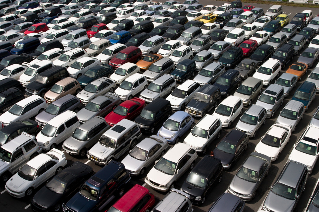 Used cars parked in a used car dealership.