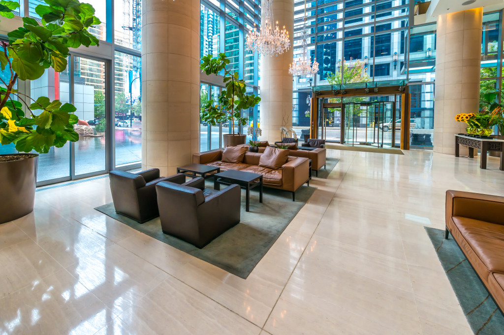 Spacious lobby with modern sofa sets and decorative plants