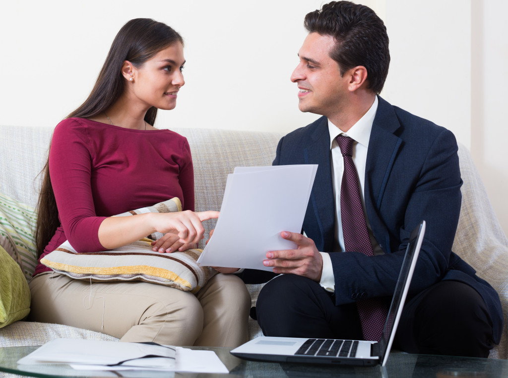 agent showing a document to his client