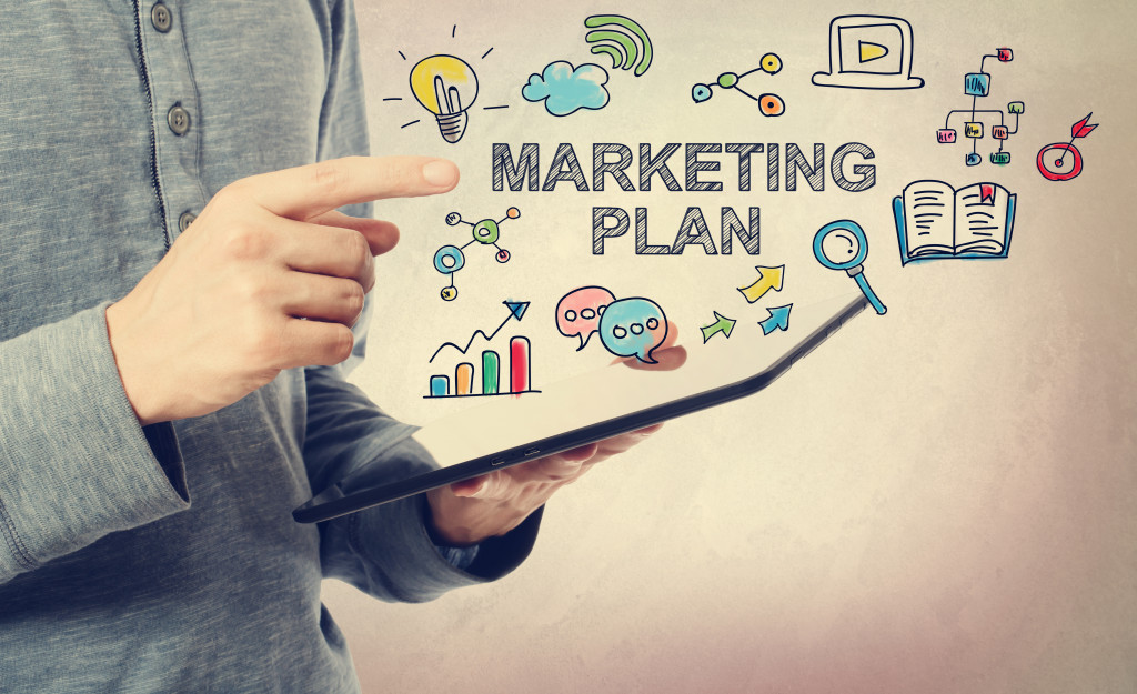 young man pointing at marketing plan