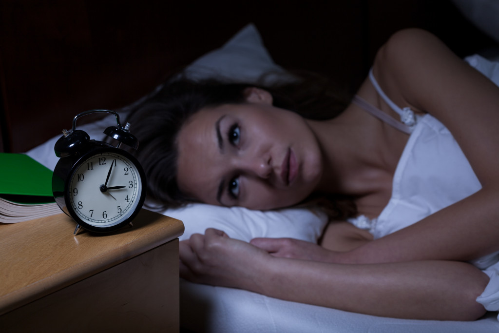 A woman not able to sleep due to insomnia