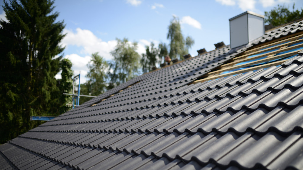 Grey roof shingles on a house. 