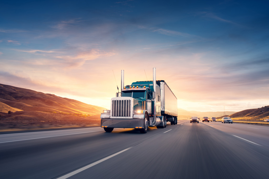 A shipping truck going through a highway