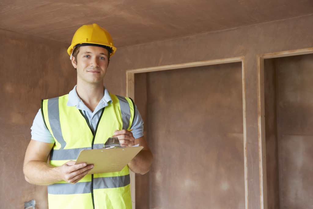 A home inspector working on a home