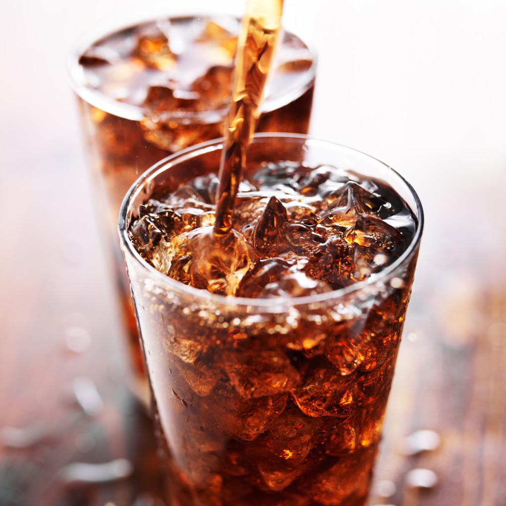 soft drink being poured into a glass