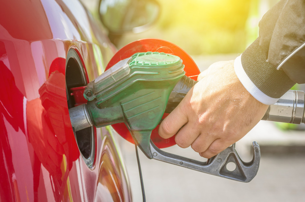 A driver pumping gasoline