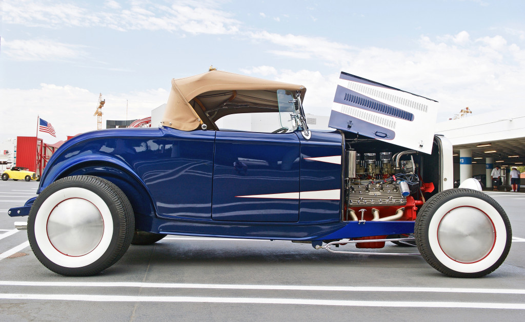 a blue luxury car with engine shown