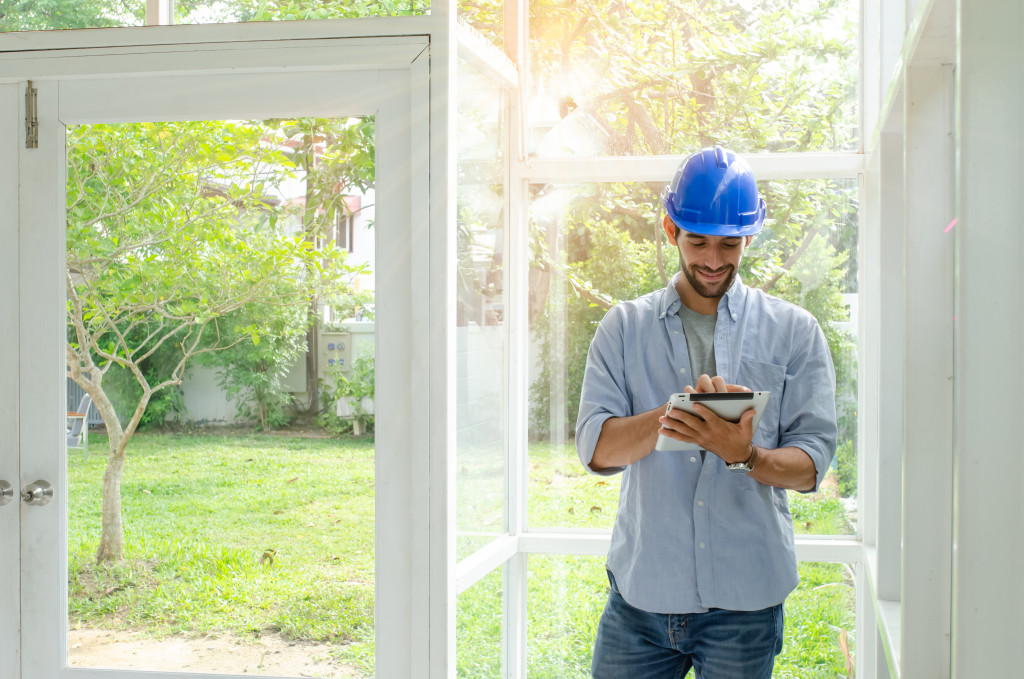 man wearing hard hat inside a house