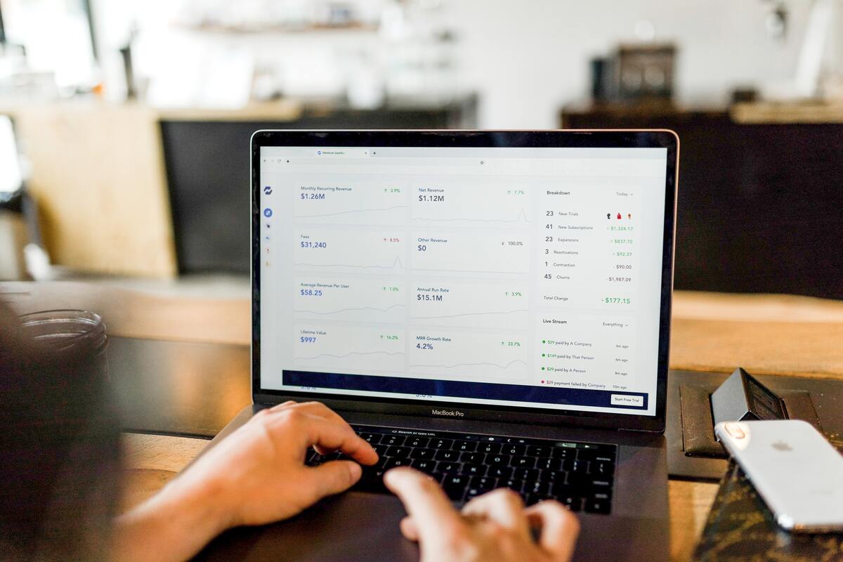 man's investment movement being shown in a laptop