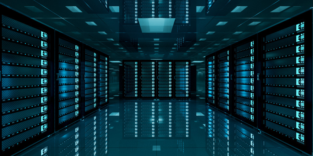 A dark data center with many glowing servers