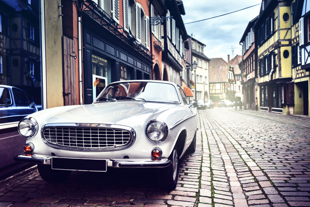 Vintage car parked at a city street.