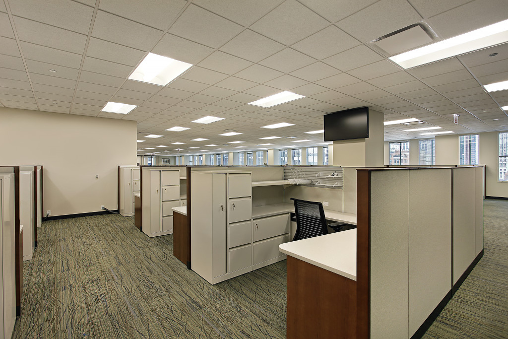 Office cubicles and a separate meeting area in a commercial building.