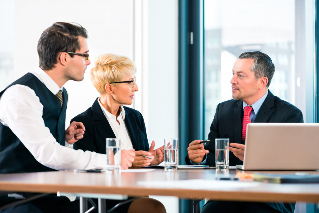 Executives discussing business matters in an office.