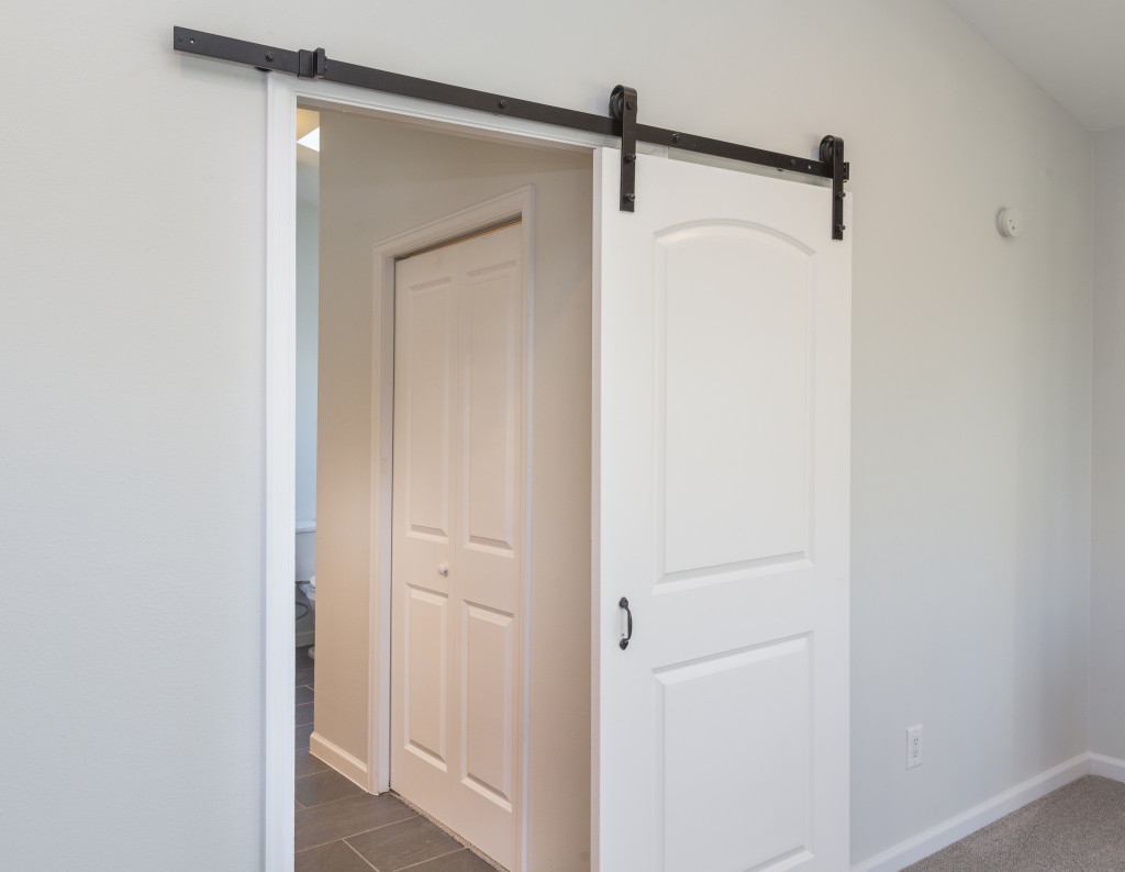 A white sliding door inside a house