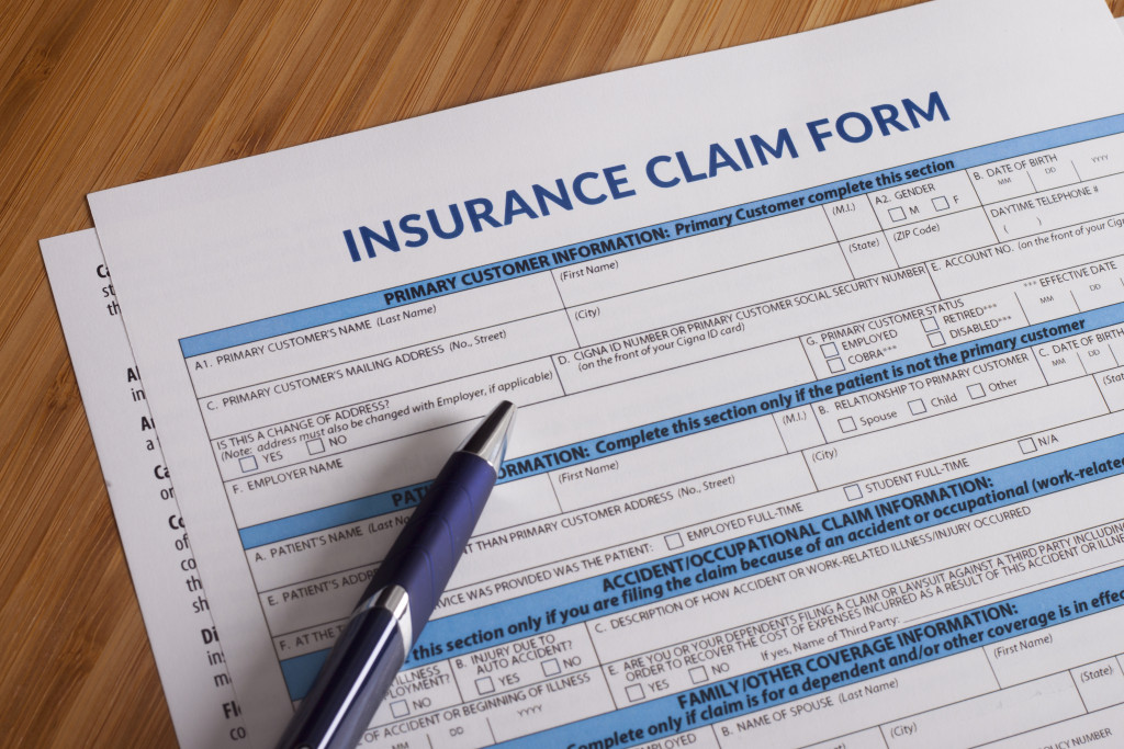 insurance claim form with pen on the side not filled out yet