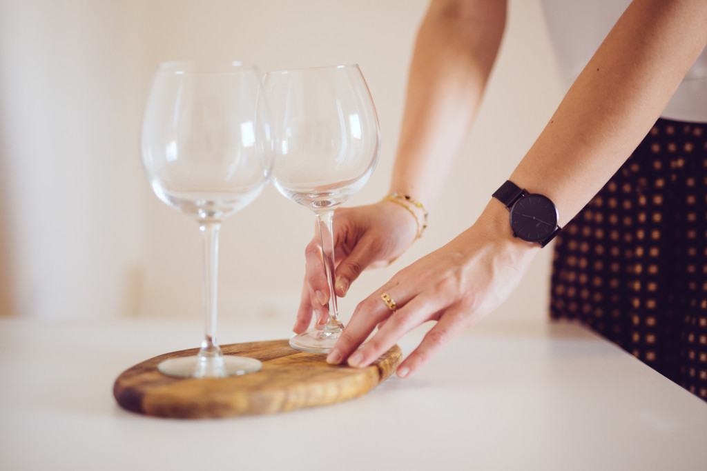 arranging two wine glasses in a table