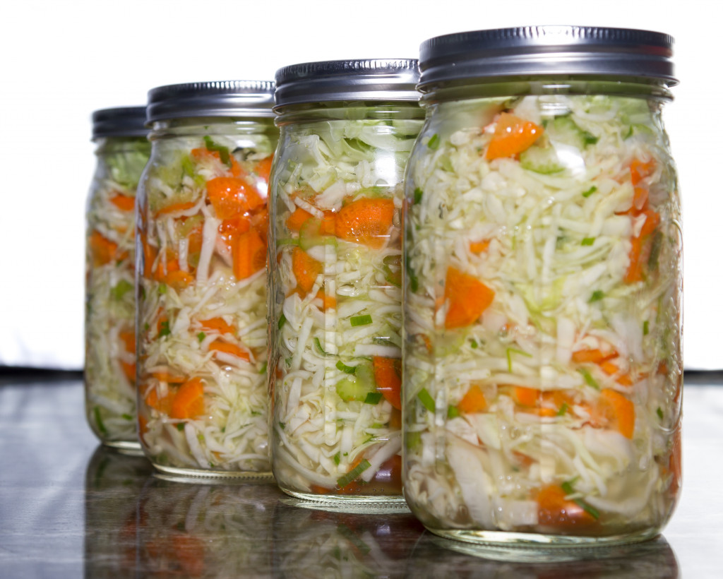 Image of four vegetable jars in a row