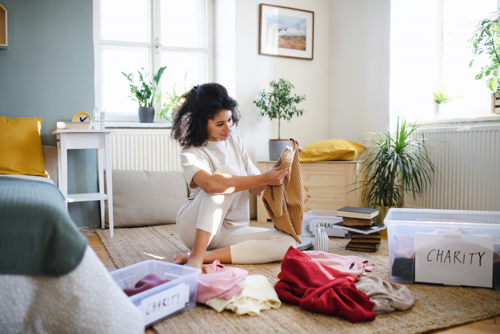 woman sorting clothes for donation