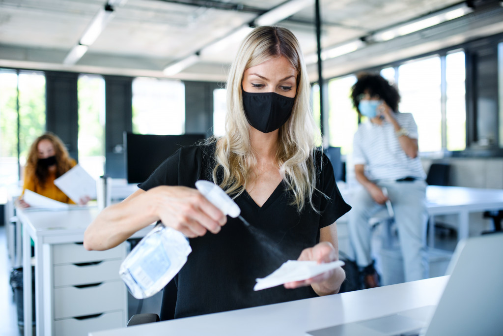 Employee cleaning her desk