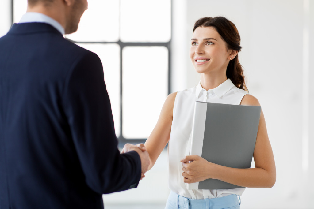 beautiful real estate agent meeting a client