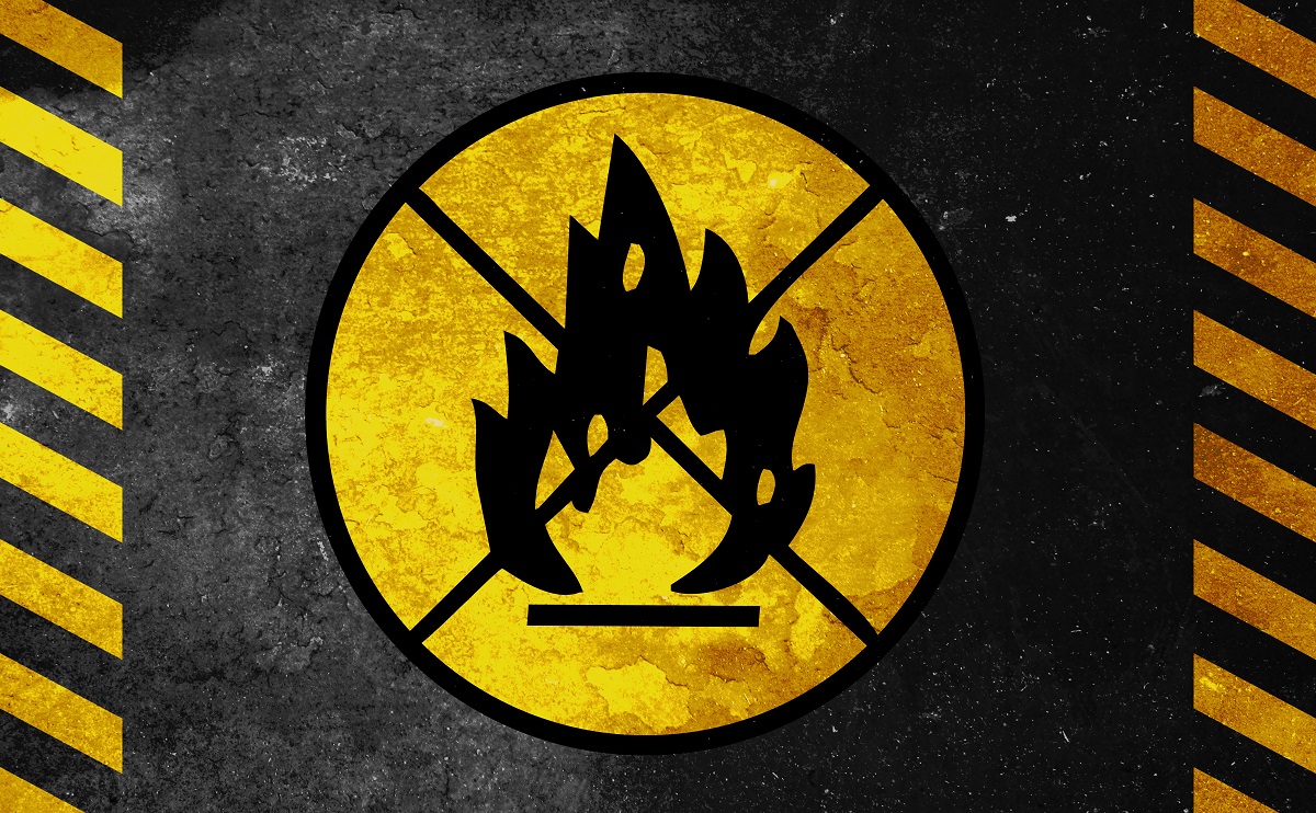 A logo of a fire with an X mark on it