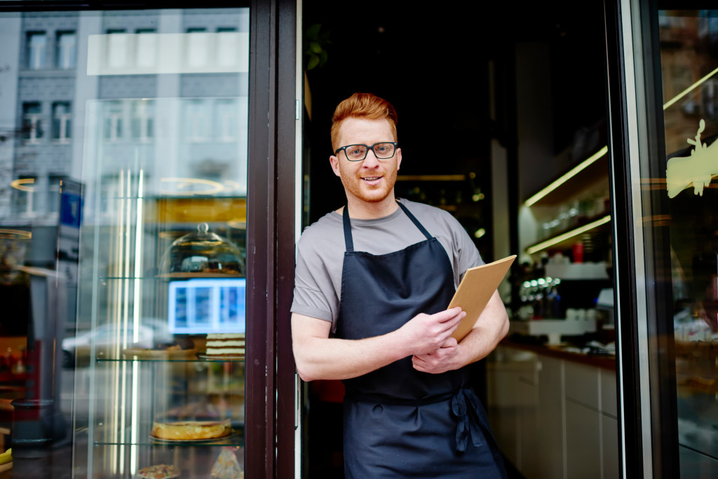 man outside his shop