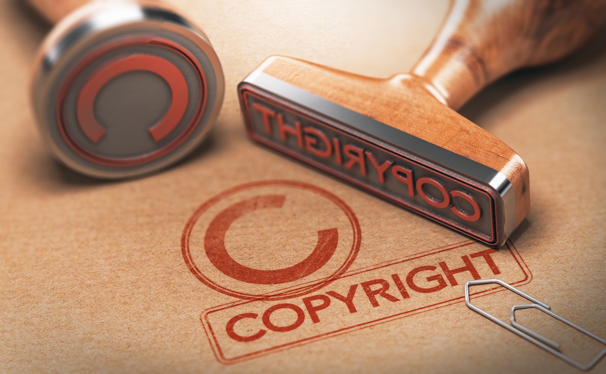 Copyright stamps with red ink and a paper clip