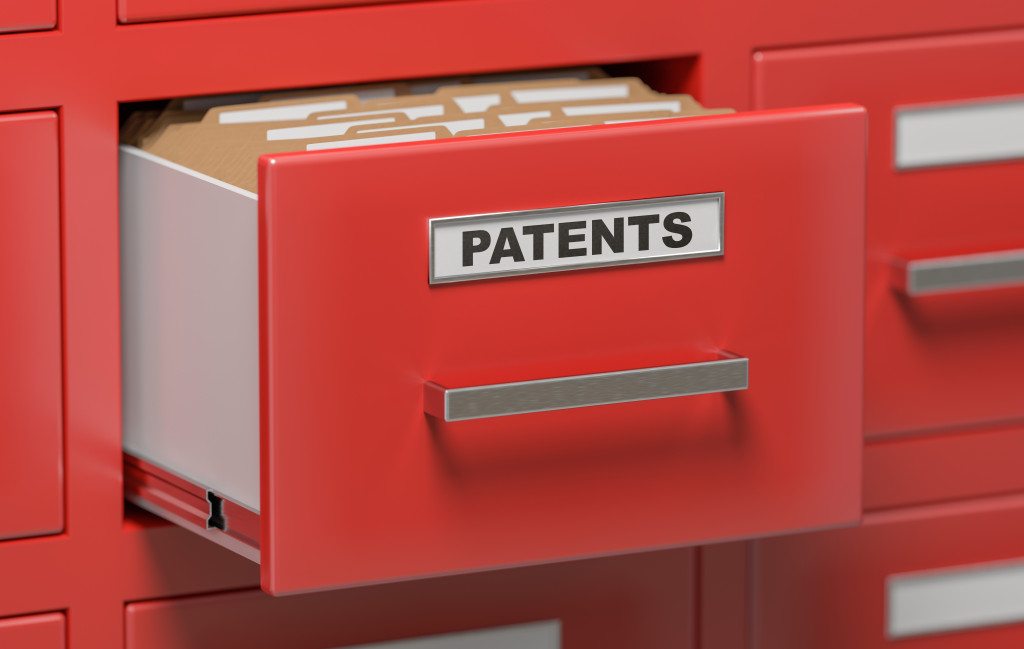 A drawer labeled with the word PATENTS with folders 