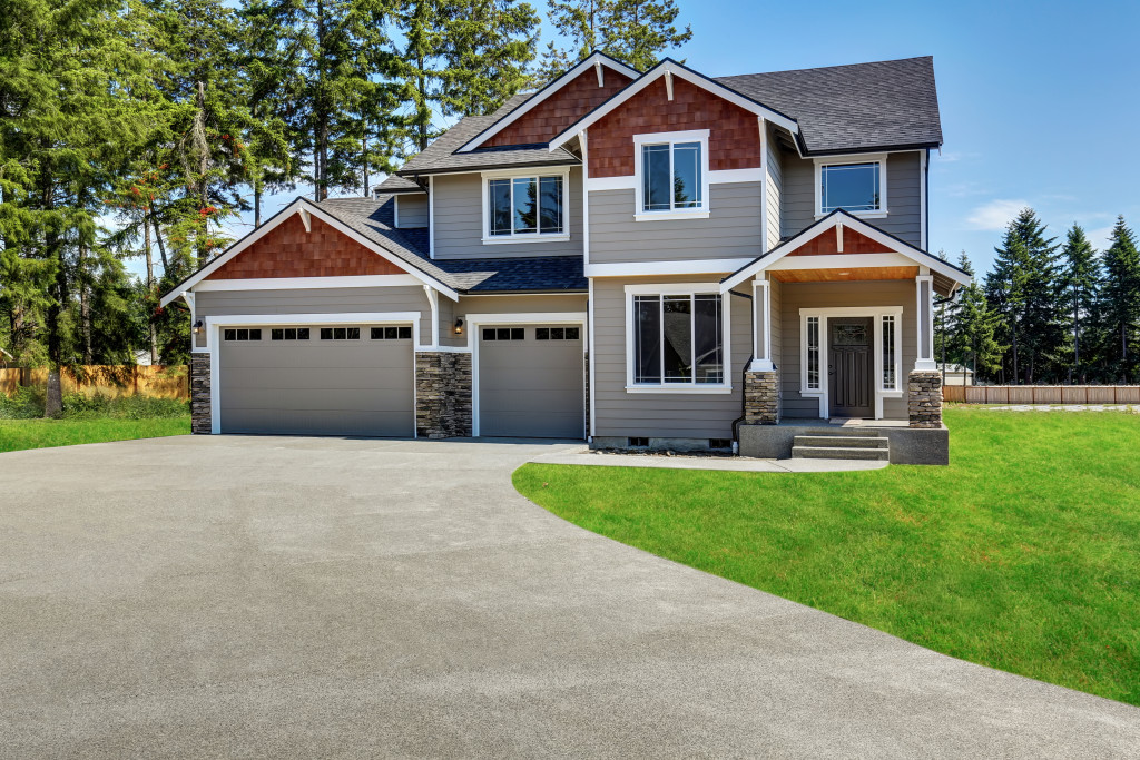 Impressive curb appeal of a house with a lawn and driveway.