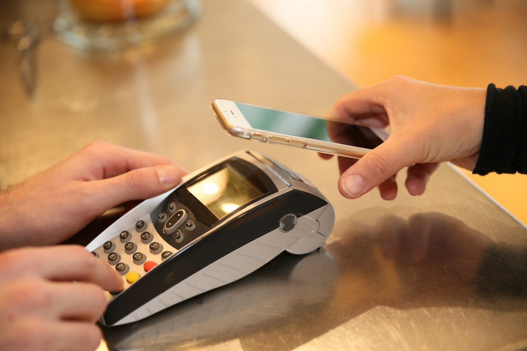 A person paying through a smartphone