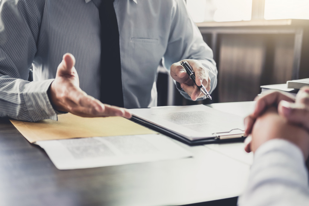 lawyer discussing zoning law to the male client