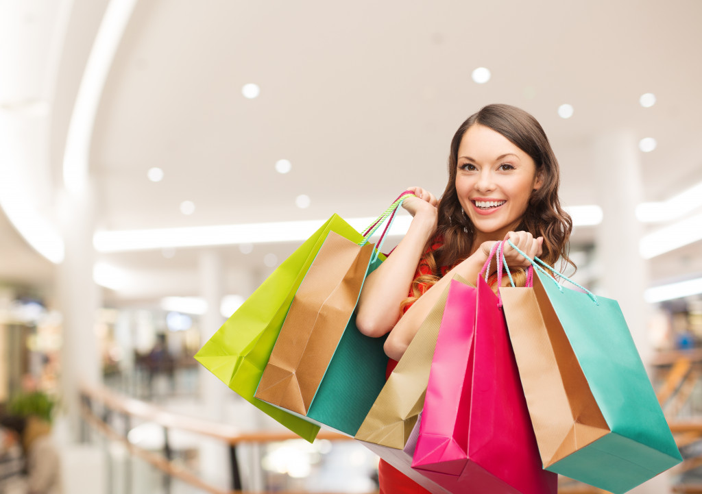 woman holding shopping bags