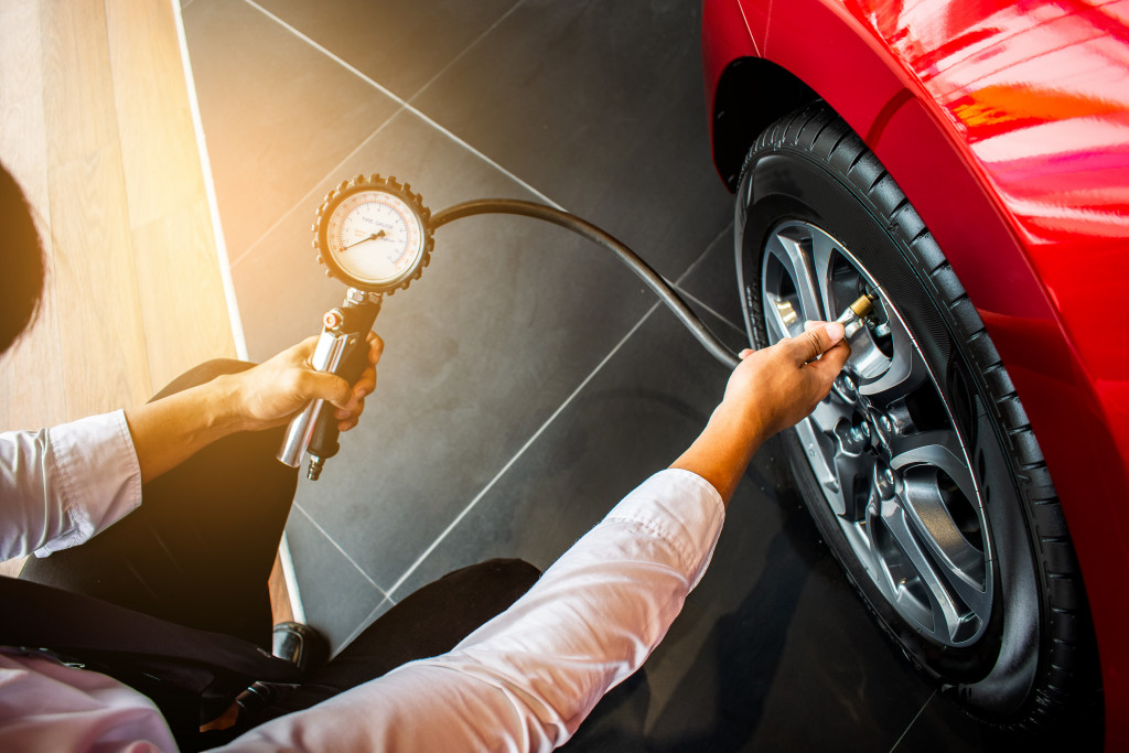 a car tire getting checked up