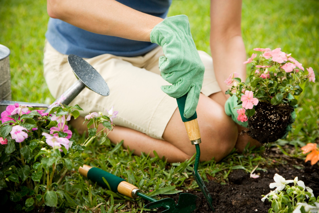 A gardener planting flowers