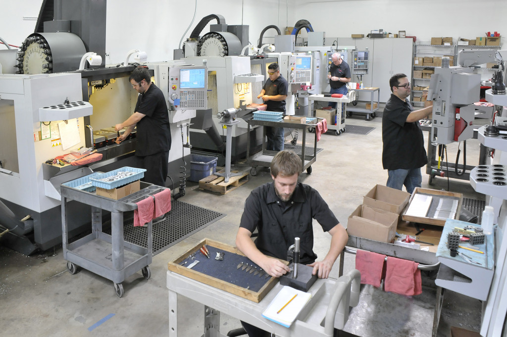 workers using CNC machines