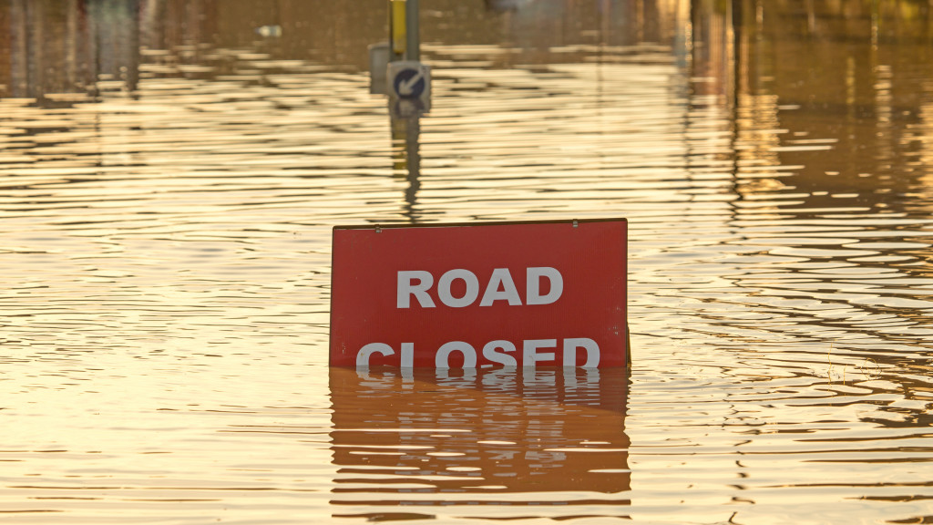 flood with road closed sign