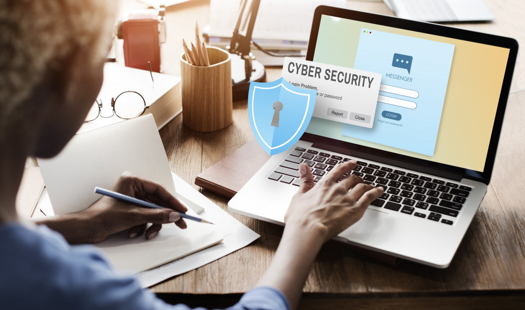 a man setting up cyber security measures on his laptop