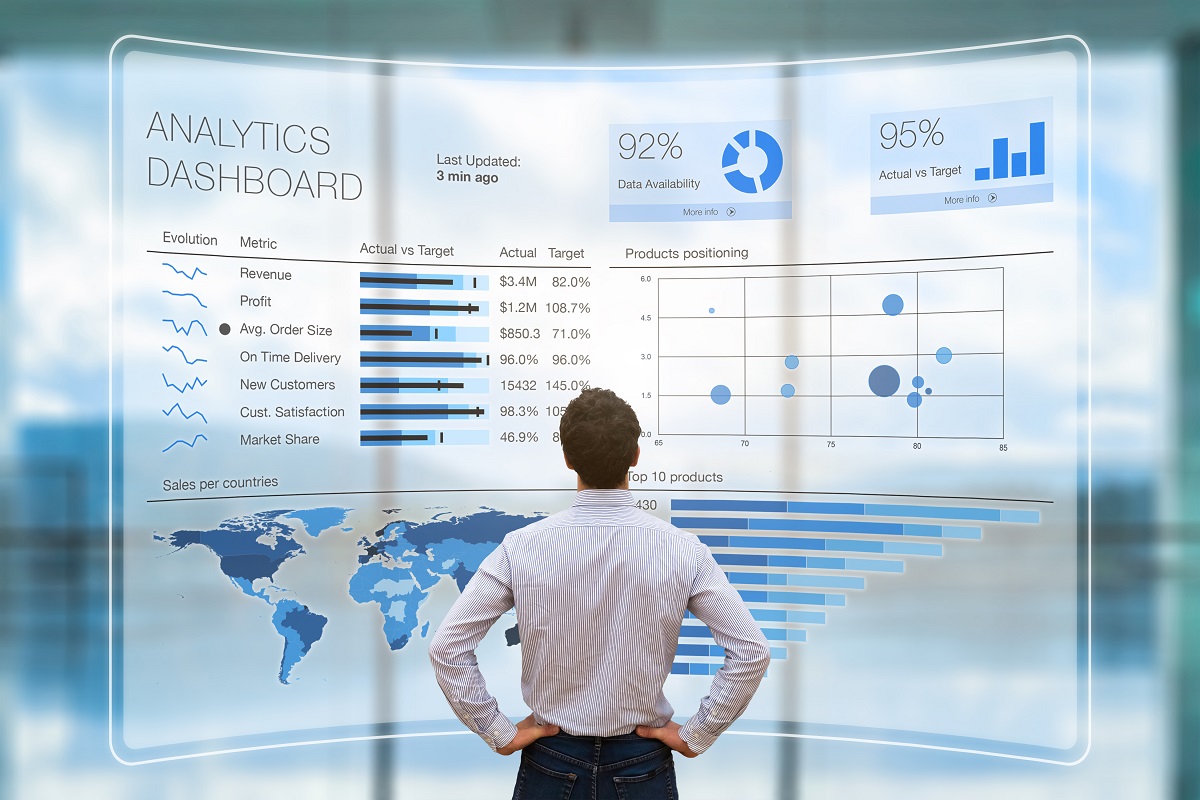 A businessman looking at a virtual analytics dashboard